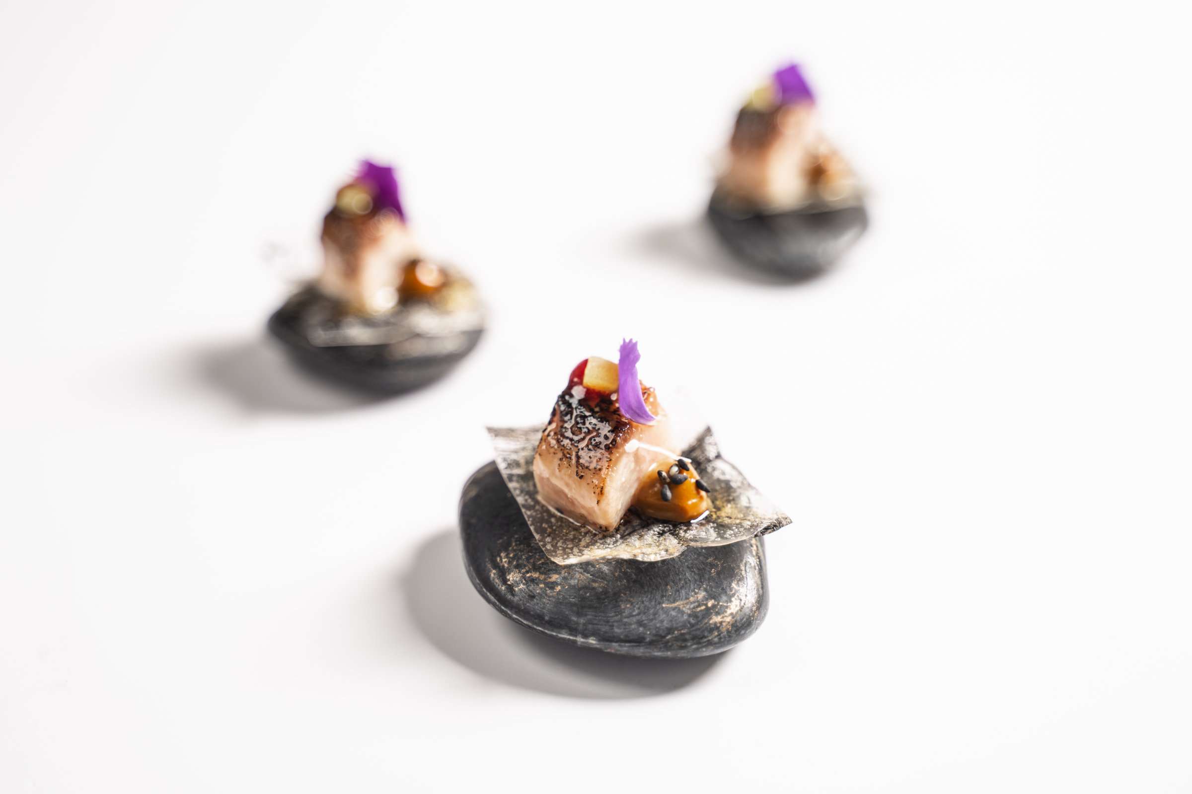 Miso glazed kingfish on rice paper canapes